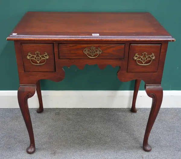 A George III style mahogany and oak three drawer lowboy, on pad feet, 78cm wide x 49cm deep.