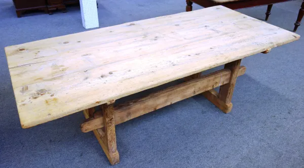 A stripped pine rectangular kitchen table, with double stretcher support, 95cm wide x 210cm long.