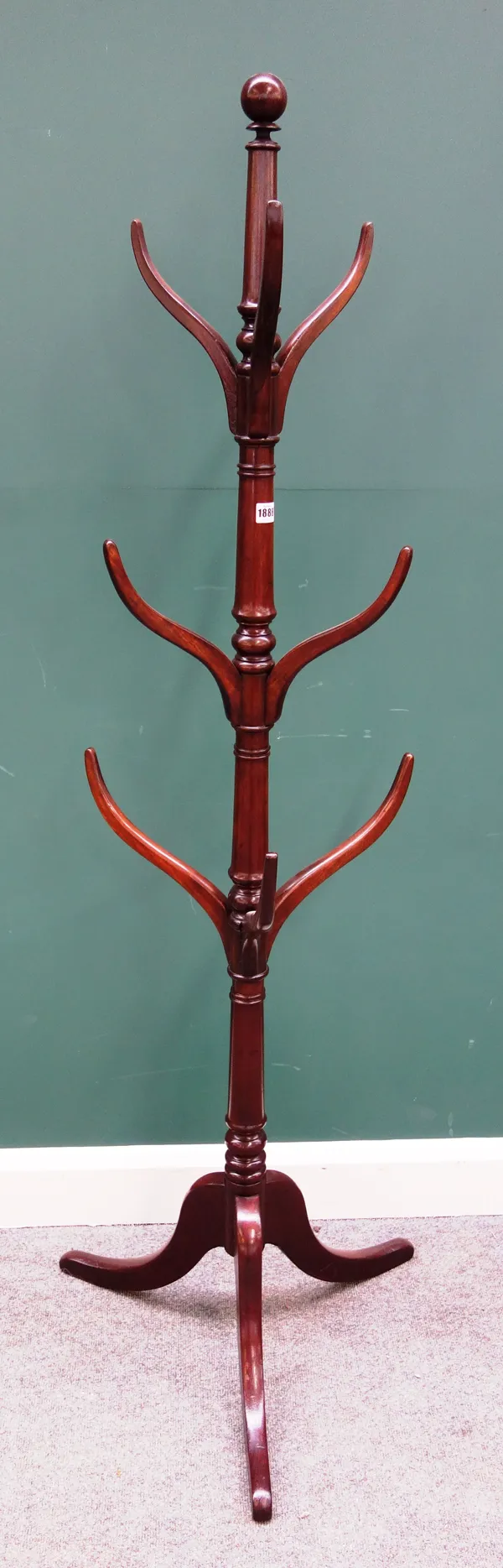 A 19th century mahogany coat/hat stand with turned column and nine hooks, 170cm high.