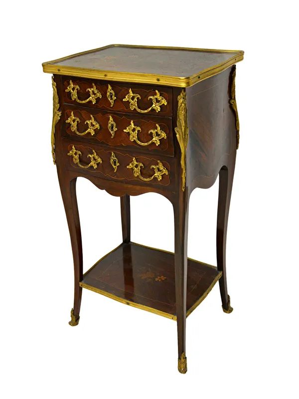 A Louis XV style marquetry inlaid gilt metal mounted three drawer petite commode, with platform undertier, 40cm wide x 76cm high.  Illustrated