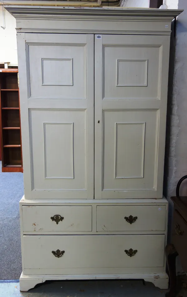 A George III later white painted housekeeper's cupboard, with panel doors over drawers, 111cm wide x 198cm high.