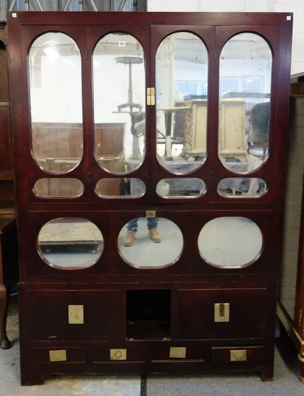 An early 20th century Chinese mirrored side cabinet with an arrangement of cupboards and drawers, 137cm wide x 193cm high.