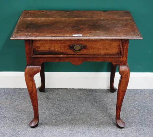 A mid 18th century oak single drawer lowboy, on pad feet, 77cm wide x 68cm high.