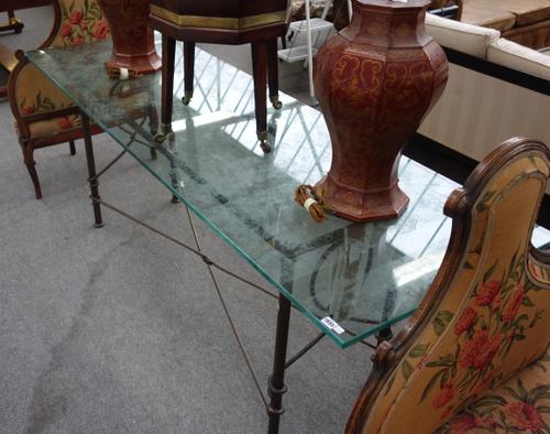 A 20th century console table, the rectangular glass top on a wrought iron base, 72cm wide x 222cm long.