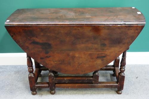 A late 17th century early 18th century yew wood gate-leg table, 103cm wide x 38cm long x 127cm long opened.