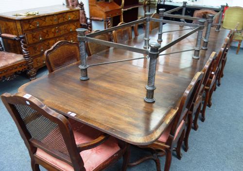 A large George III style mahogany extending dining table, on six downswept supports, three extra leaves, 111cm wide x 183cm long x 319cm extended.