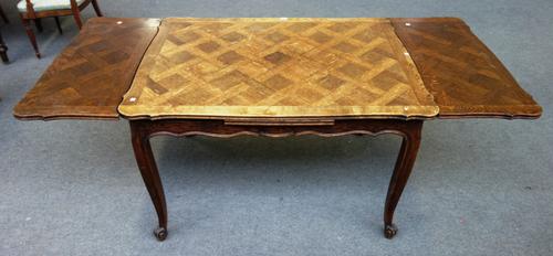 A late 19th century/early 20th century ash and oak parquetry inlaid draw-leaf dining table, on scroll supports, 90cm wide x 120cm long x 200cm extende