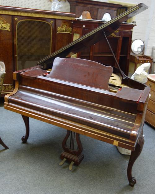 Hagspiel, Berlin, retailed by Lyon & Hall Ltd, Brighton; a mahogany cased overstrung boudoir grand piano, with lyre pedal supports, the frame stamped