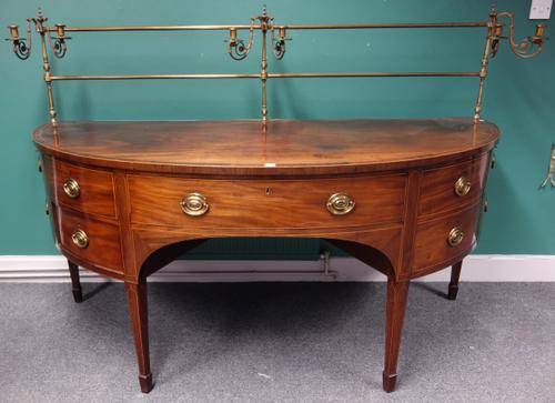 A George III Scottish inlaid mahogany bowfront sideboard, with candle sconce mounted brass galleried back, on tapering square supports, 196cm wide x 8