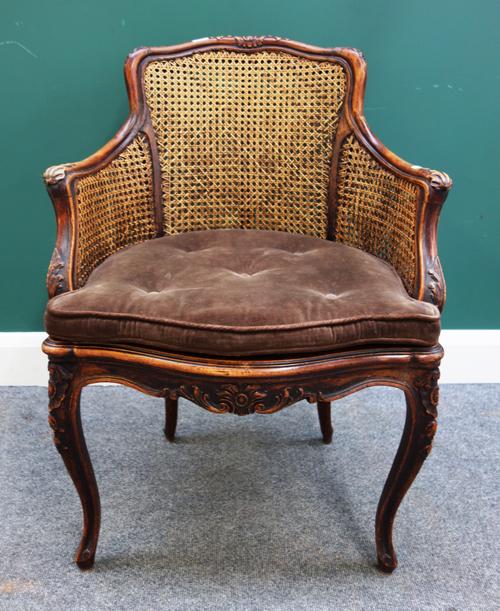 A Louis XV stained and carved beech framed tub back fauteuil with serpentine seat, 60cm wide x 85cm high.