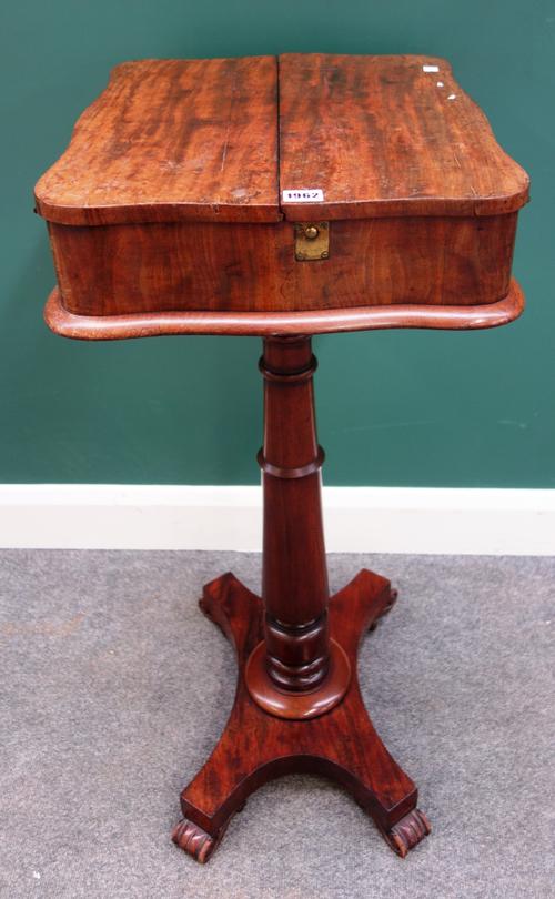 A George IV mahogany pedestal shaving stand with a fold-out top, on triform platform, 49cm wide x 94cm high.