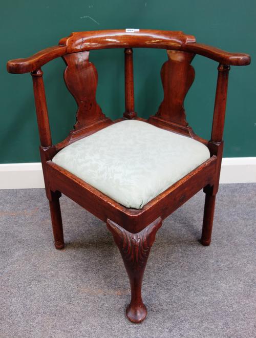 A George II walnut double vase back corner chair, 70cm wide x 80cm high.