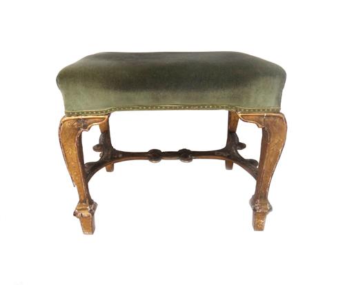 A George I gilt framed rectangular footstool on square cabriole supports united by shaped stretcher, 62cm wide x 48cm high deep x 53cm high.   Illustr