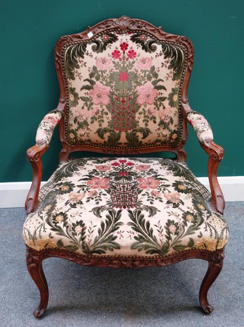 M. Cresson; a Louis XV stained beech open arm fauteuil, on scroll supports, stamped to back rail, 70cm wide x 92cm high.