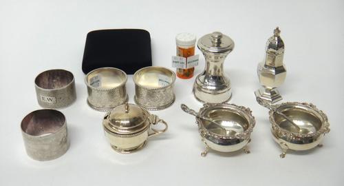 Silver and silver mounted wares, comprising; a pair of shaped circular salts, each raised on three feet, London 1908, a pair of salt spoons, London 19