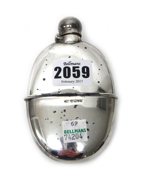 A Victorian silver spirit flask, of oval form, Sheffield 1889, with a pull-off beaker base, Sheffield 1887, weight 102 gms.