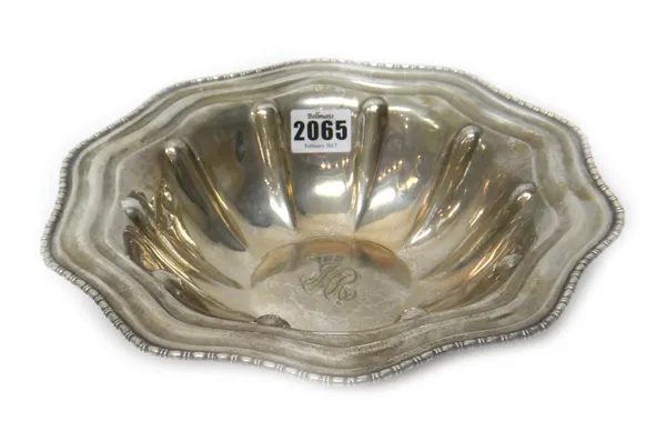 A Sterling silver shaped circular bowl, decorated with lobed panels within a beaded rim, monogram engraved to the centre, detailed Sterling, diameter