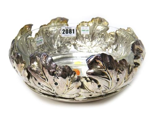 A Italian bowl, decorated with a border of large leaves, diameter 23cm, detailed 925, weight 562 gms, with a lead crystal glass liner,