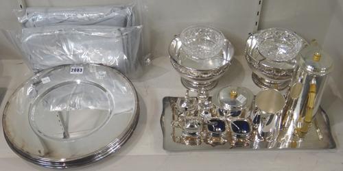 Plated wares, comprising; a set of twelve circular main course plates, diameter 30cm, with grey fabric bags, a pair of caviar bowls, with faceted glas