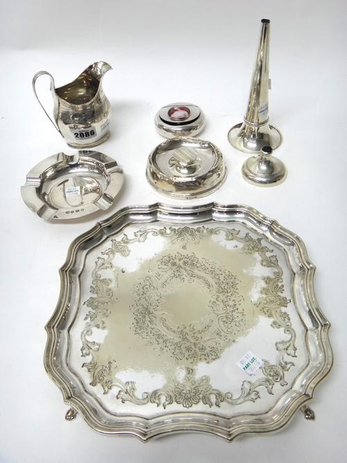 Silver and silver mounted wares, comprising; a George III helmet shaped milk jug, London 1802, a circular ashtray, Sheffield 1923, another ashtray, a