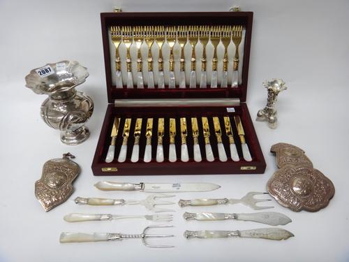 A flower vase, having a shaped rim, on a weighted circular base, detailed 925, a set of twelve pairs of gold plated dessert or fruit knives and forks,