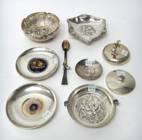 A Greek shaped circular bowl, the centre decorated with a floral panel, detailed 925, two ashtrays, both detailed 925, two circular dishes, detailed 9