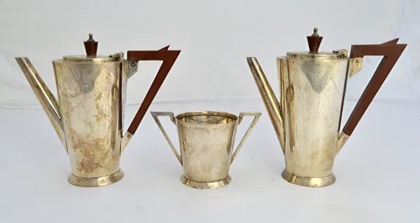 A silver three piece part cafe au lait set, comprising; a coffee pot, a hot milk jug and a twin handled sugar bowl, each piece of tapered cylindrical