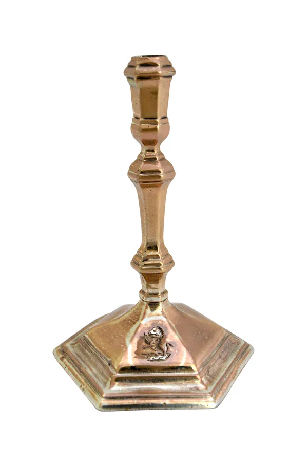 A George I silver Britannia standard taper stick, having a knopped stem and on a hexagonal foot, later crest engraved, height 11cm, London 1717, weigh