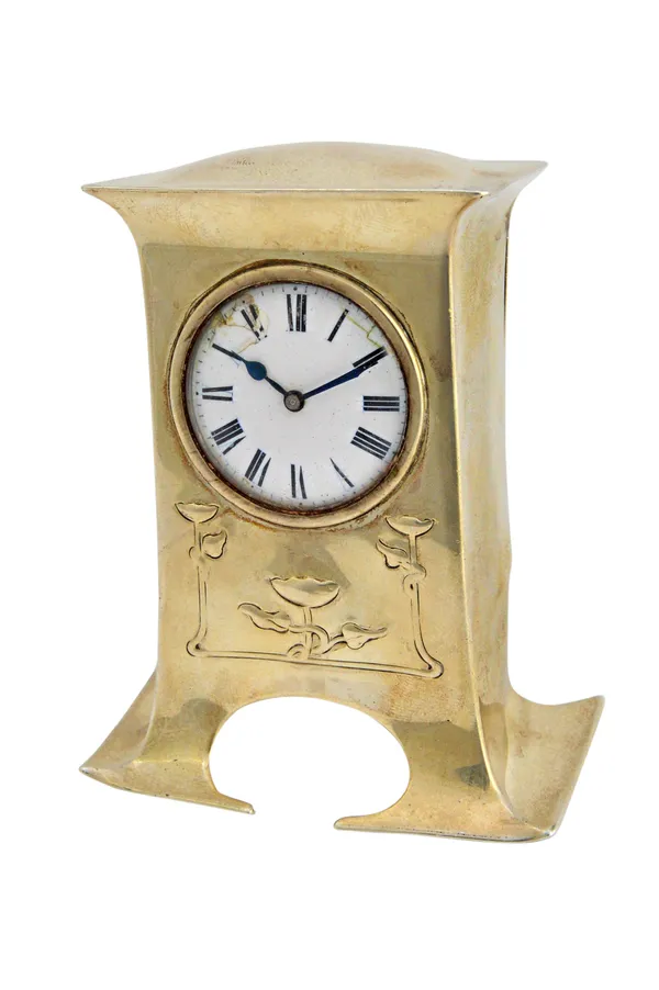 A silver shaped rectangular cased miniature timepiece clock, with a key wind movement, the circular enamelled dial with black Roman numerals and with