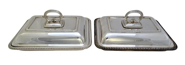 A pair of silver rectangular lidded entree dishes, each decorated with gadrooned rims and with detachable handles, Sheffield 1926, combined weight 331