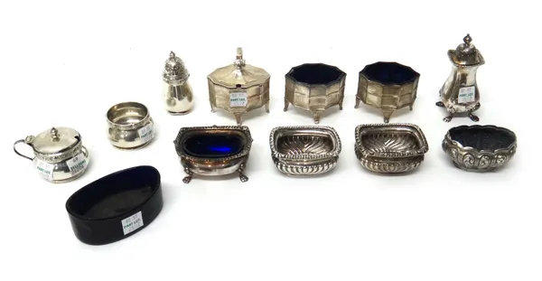 Silver condiments, comprising; a mustard pot, raised on four feet, London 1913, two salts in a similar design, London 1910 and 1913, two salts of matc