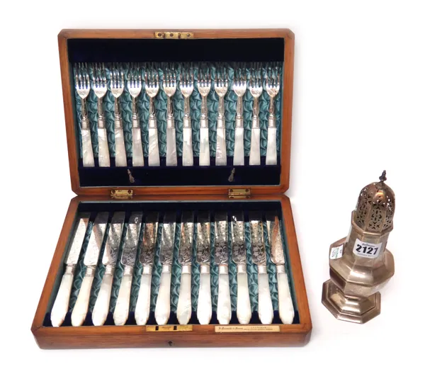 A silver sugar caster, of octagonal baluster form, Sheffield 1902, weight 176 gms and a set of twelve pairs of plated dessert or fruit knives and fork