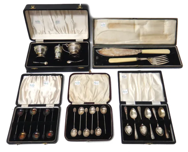 Silver, comprising; a three piece condiment set, comprising; a mustard pot, a salt and a pepperette, Birmingham 1947 and two silver condiment spoons,