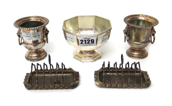 A silver octagonal sugar bowl, decorated with reeded rims, Sheffield  1931, a pair of Victorian small toastracks, with loop shaped handles with integr