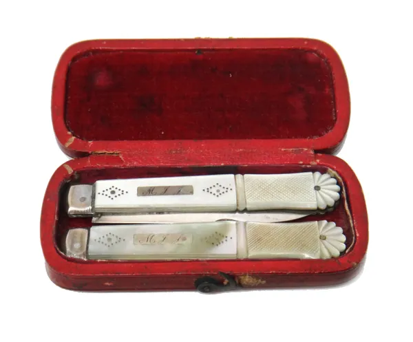 A William IV silver and mother of pearl travelling folding fruit knife and fork, the blade and the prongs, Sheffield 1830, the mother of pearl handles