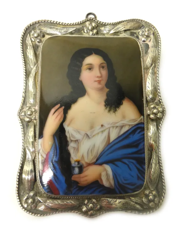 A silver mounted shaped rectangular frame, enclosing a rectangular continental ceramic plaque depicting a woman with an open scent bottle, the frame d