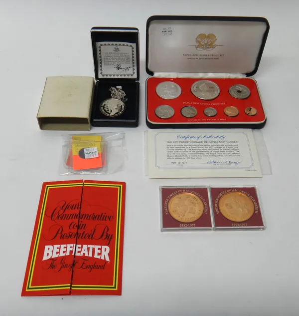 A Papua New Guinea 1977 eight coin specimen proof set, with a case, a pendant medallion commemorating the 1977 Silver Jubilee with a silver neckchain,