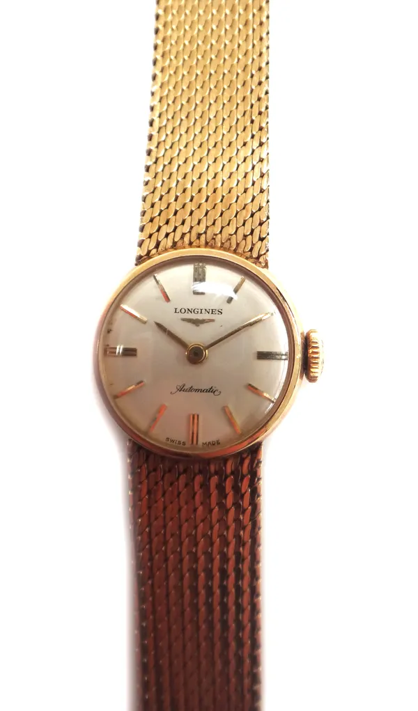 A lady's 9ct gold Longines Automatic bracelet wristwatch, the signed circular dial with gilt baton shaped numerals on a tapering woven link bracelet w