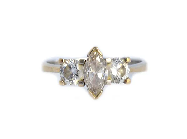 A white gold and diamond set three stone ring, claw set with the marquise shaped diamond at the centre, between two circular cut diamonds, detailed 75