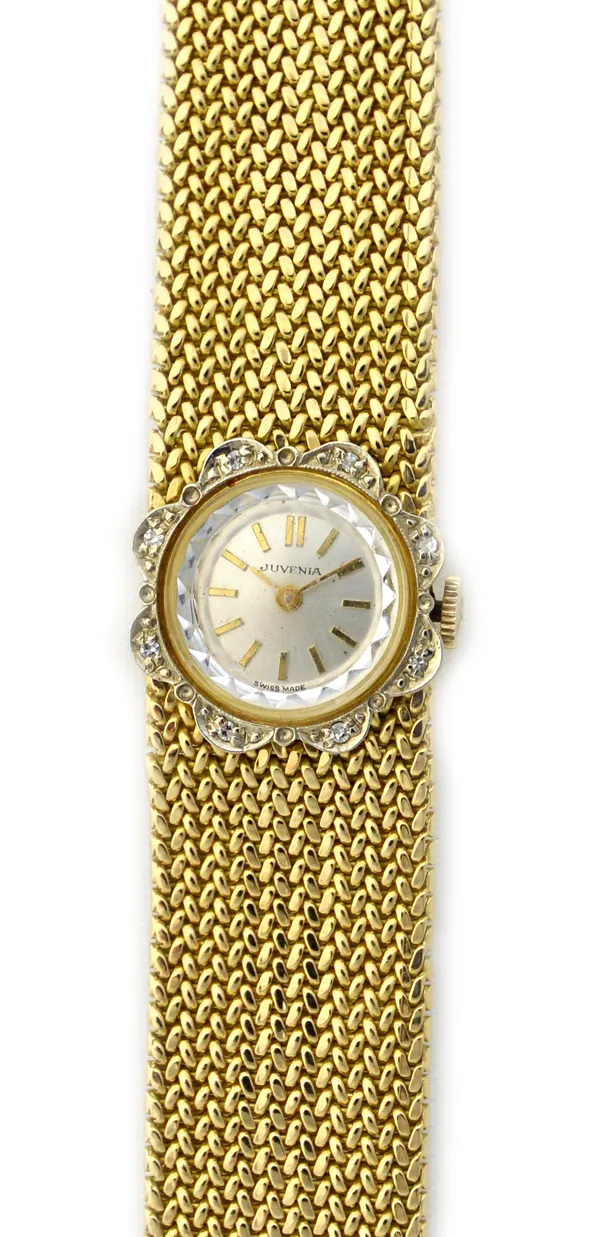 A Juvenia gold and diamond set lady's bracelet wristwatch, the signed circular silvered dial with gilt baton shaped numerals, the shaped circular beze