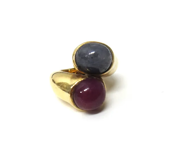 A gold, cabochon sapphire and cabochon ruby set two stone ring, in a twistover design, ring size H, gross weight 18 gms, (possibly loaded).