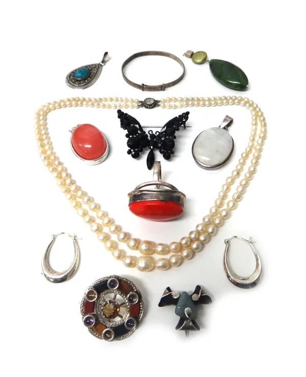 A two row necklace of graduated cultured pearls, a silver mounted agate and gem set brooch, probably Scottish, circa 1926, two further brooches, four