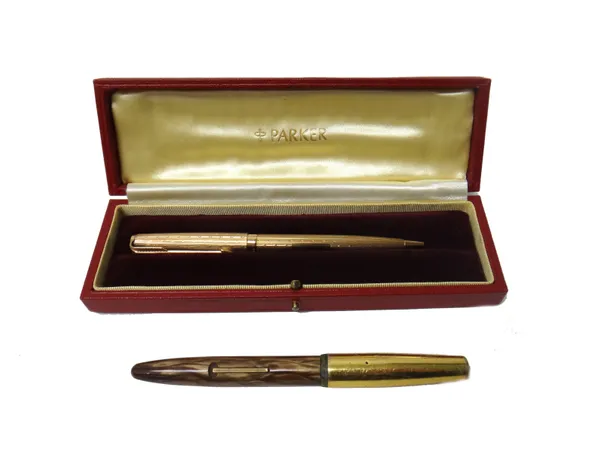 A 9ct gold cased Parker ballpoint pen, with engine turned decoration, with the original instructions and Parker case and a Platignum fountain pen, (2)