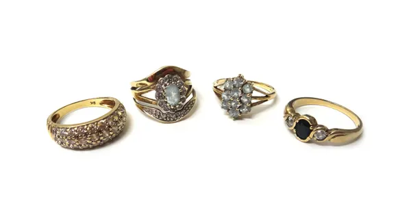 A 9ct gold, sapphire and colourless gem set three stone ring, a 9ct gold and colourless gem set half hoop ring, in a three row design and two further