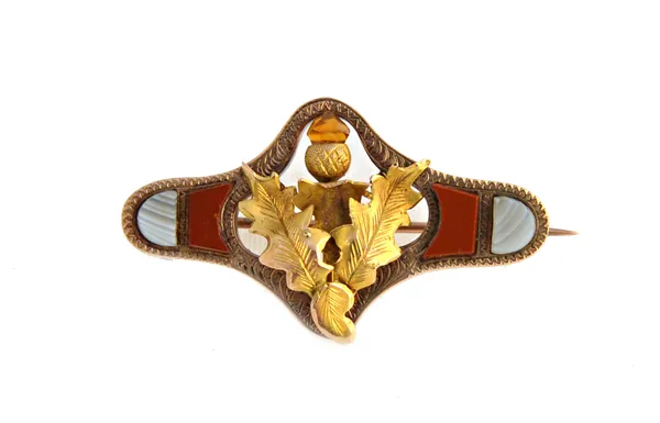 A  9ct gold, jasper and banded grey agate set Scottish brooch, designed as a thistle within a shaped surround, by Joseph Cook and Sons, Birmingham.  I