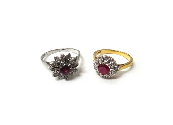 A gold, ruby and diamond set cluster ring, claw set with a circular cut ruby at the centre, in a surround of circular cut diamonds, detailed 18 CT, ri