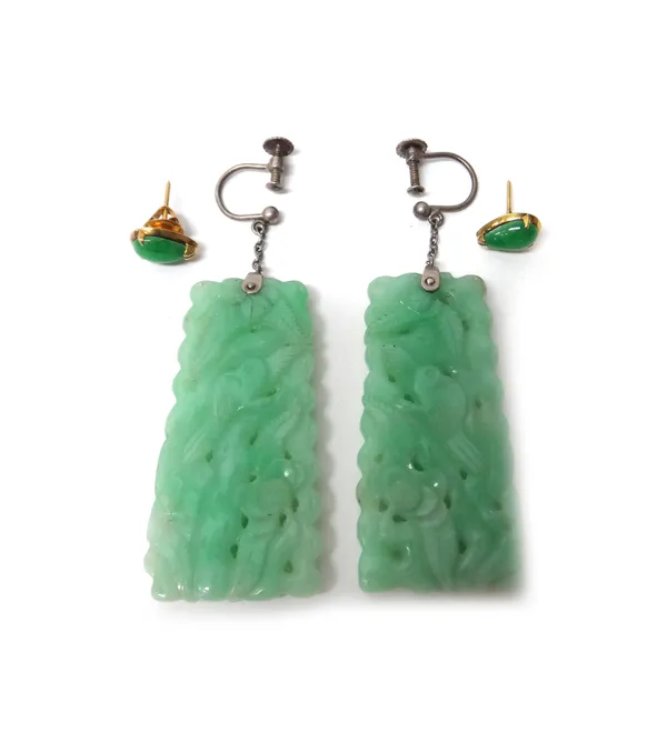 A pair of carved jade pendant earrings, each in a tapered drop shaped design, with carved and pierced decoration, the tops with screw fittings and a p