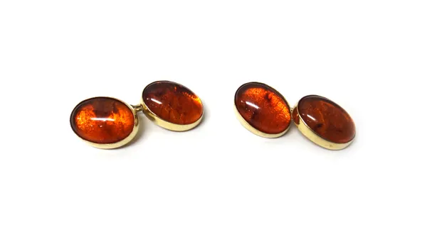 A pair of 9ct gold and cabochon amber dress cufflinks, with amber mounted backs and fronts, London 1986, gross weight 8.2 gms.