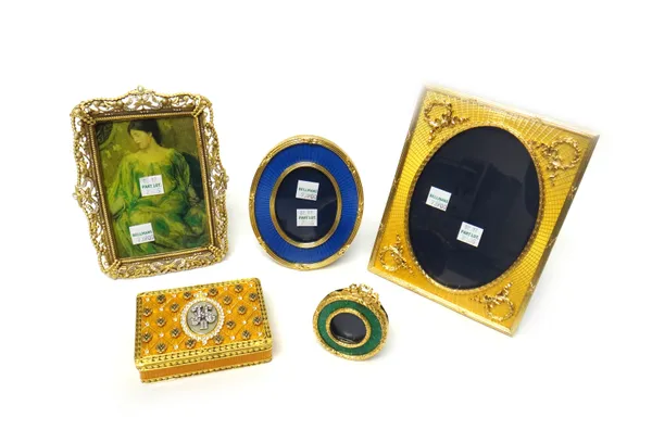 A gilt metal, yellow enamelled and colourless paste set rectangular box and cover, decorated with a cypher in the Russian style, three gilt metal and