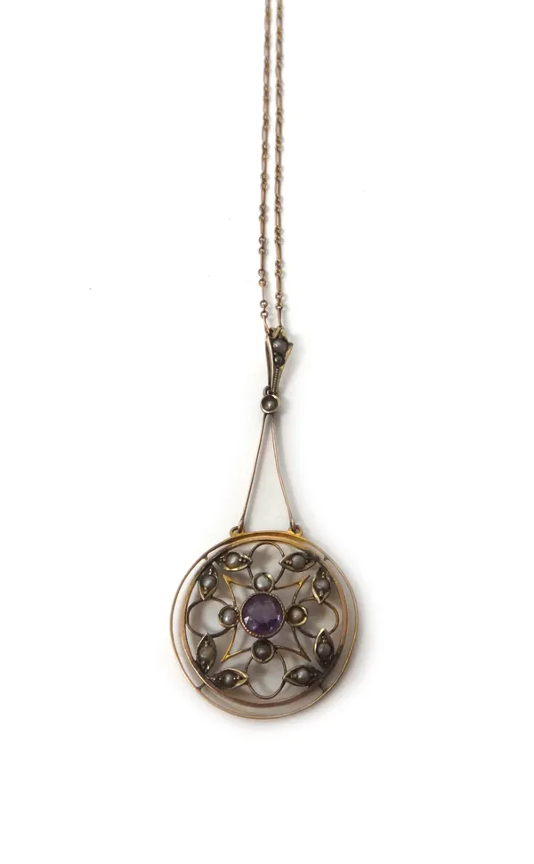 A gold, amethyst and seed pearl set pendant, pierced in a circular design, with a gold neckchain, detailed 9 C, on a boltring clasp